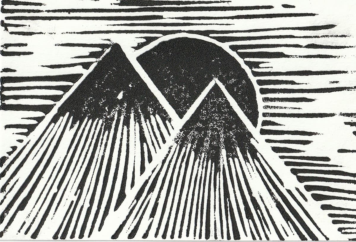 Mountain Peek — hand-carved linocut print, black ink on white paper, silhouette of mountain peaks